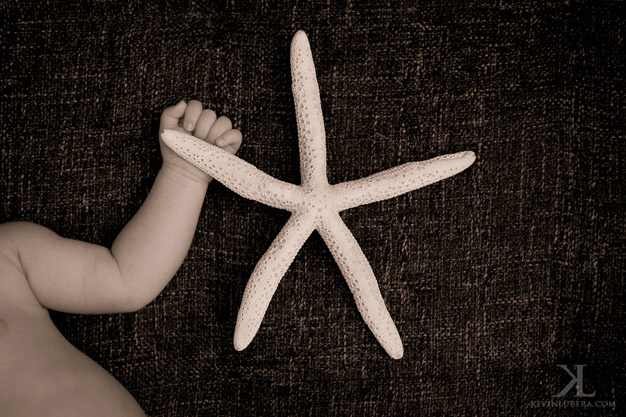 Baby holding starfish